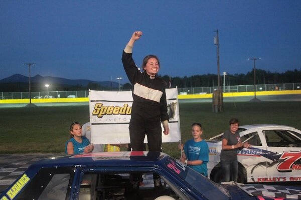 Fifteen-year-old Reilly Lanphear celebrates her first career Street Stock win on Saturday night at Speedway 51. (Alan Plummer photo)